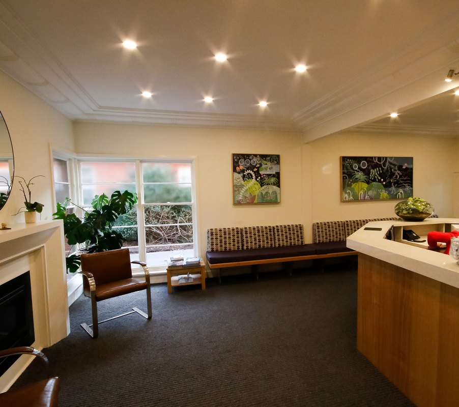The waiting room with its fireplace and garden window